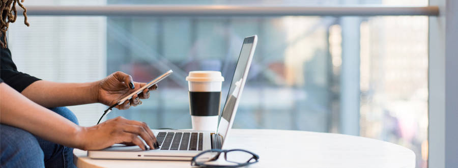 Woman On Mobile And Laptop 900X330