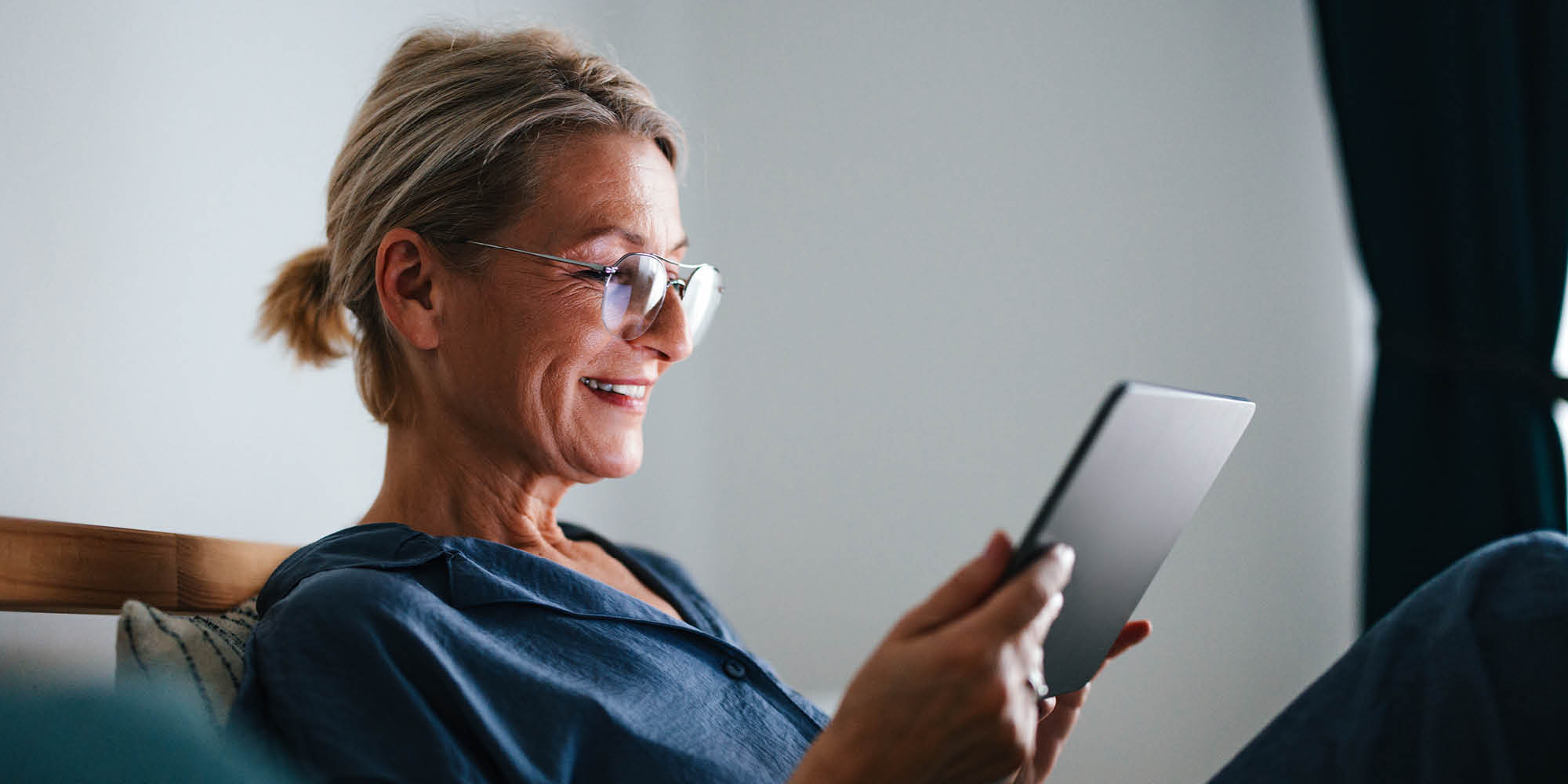 Woman looking at a tablet computer