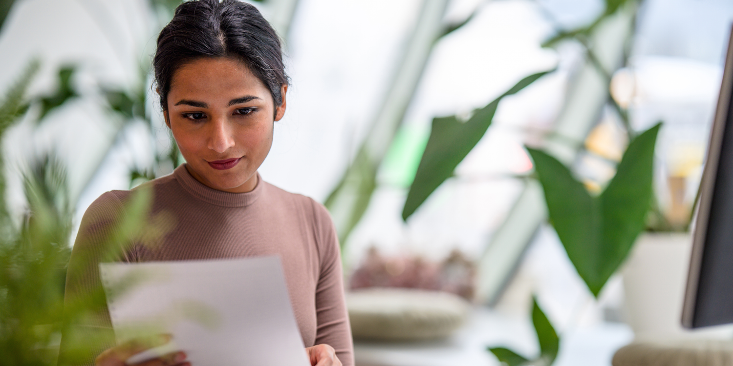 Woman looking at report