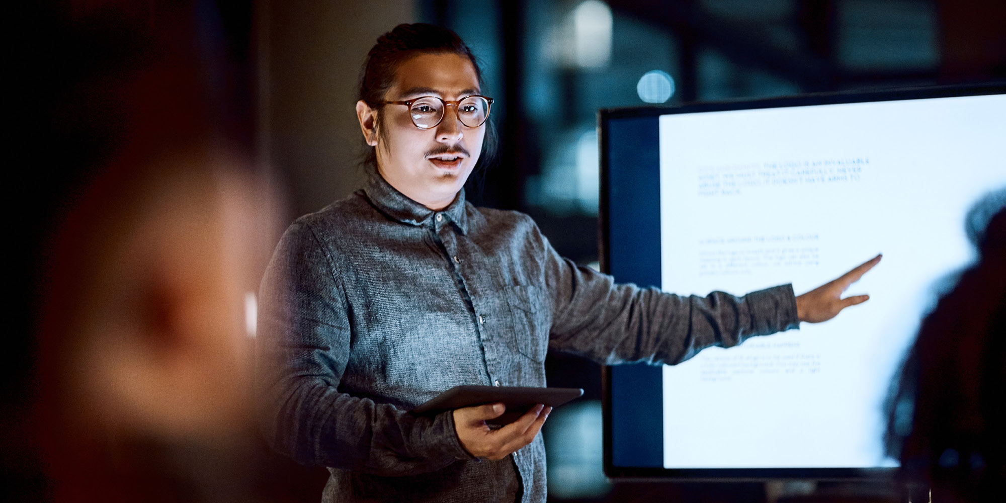 Man pointing at screen